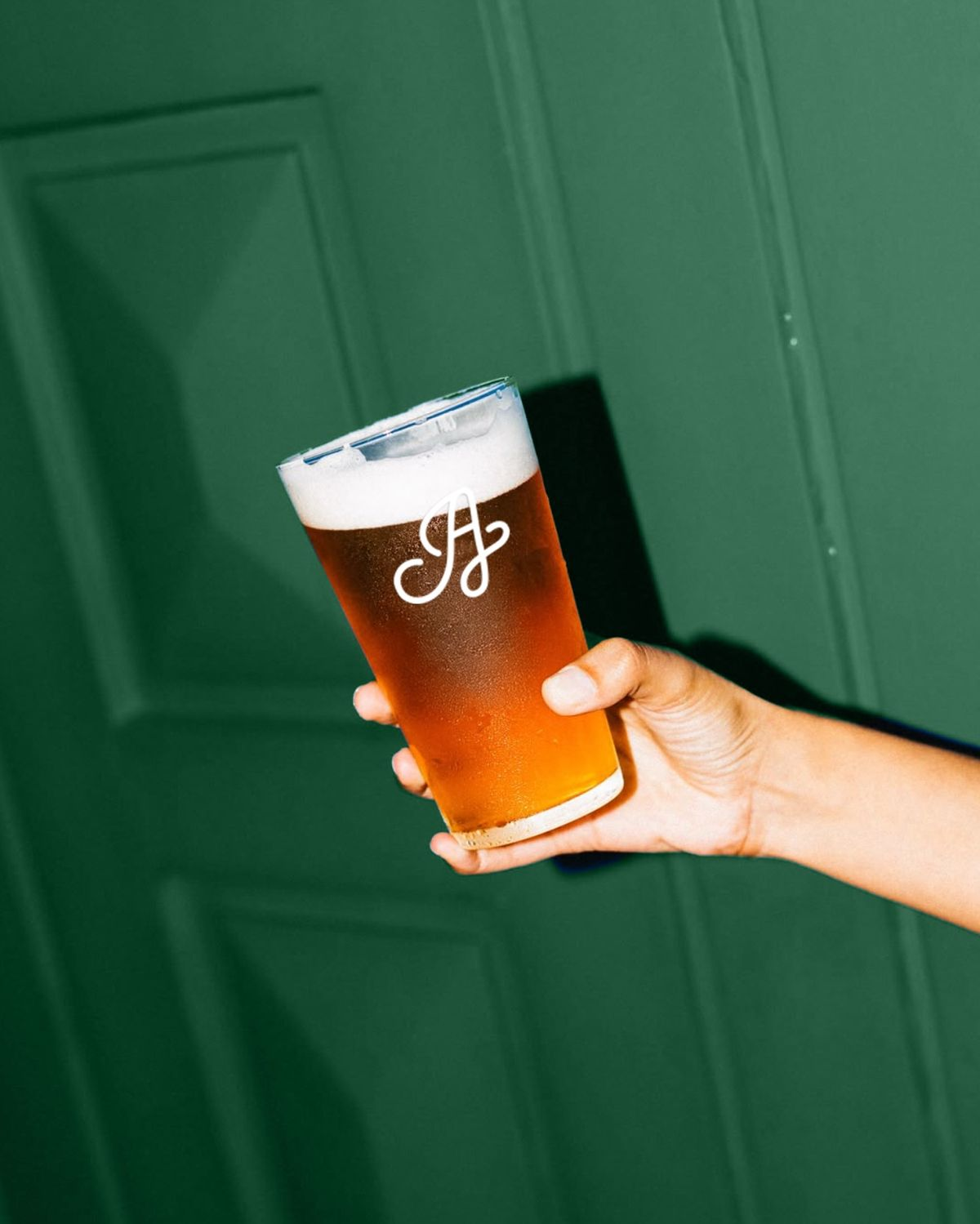 Two guests toasting at a colorful bar at AREA15